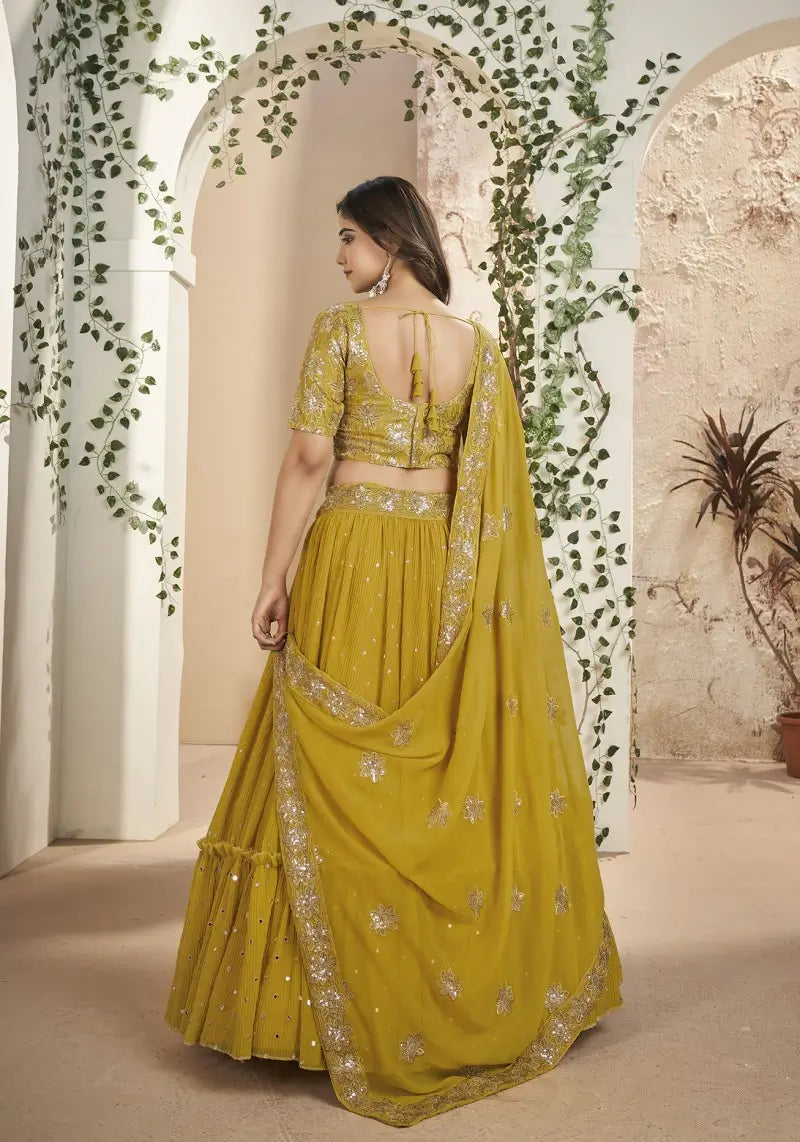Mustard Faux Georgette Sequins Embroidered Lehenga Choli