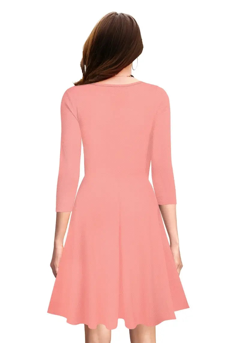 Back view of model wearing Chic Peach Fit & Flare Flounce Hem Dress with 3/4 sleeves and flared hem.