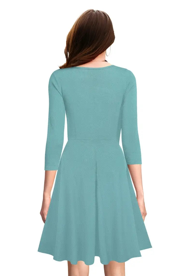 Back view of model wearing Chic Pista Fit & Flare Flounce Hem Dress with 3/4 sleeves and flared hem.