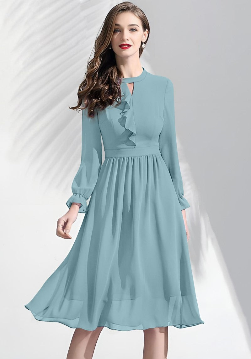 Pista ruffle midi dress worn by model featuring sheer bishop sleeves and keyhole neckline.