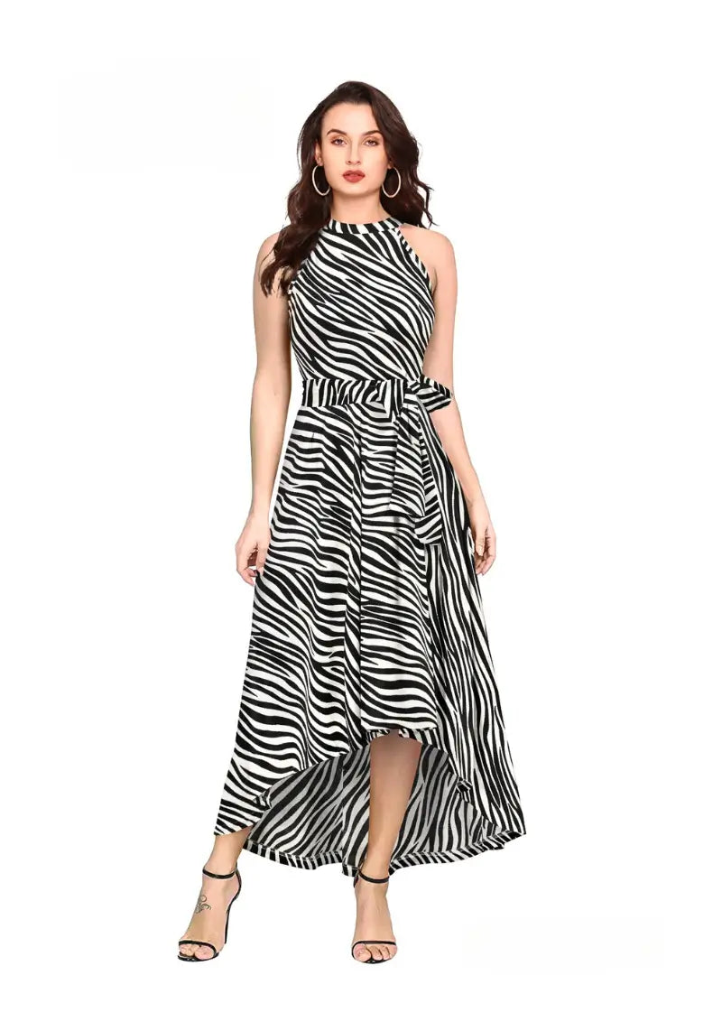 Front view of the model wearing White Zebra Print Western One Piece Dress featuring halter neck sleeveless high-low silhoutte and waist belt.