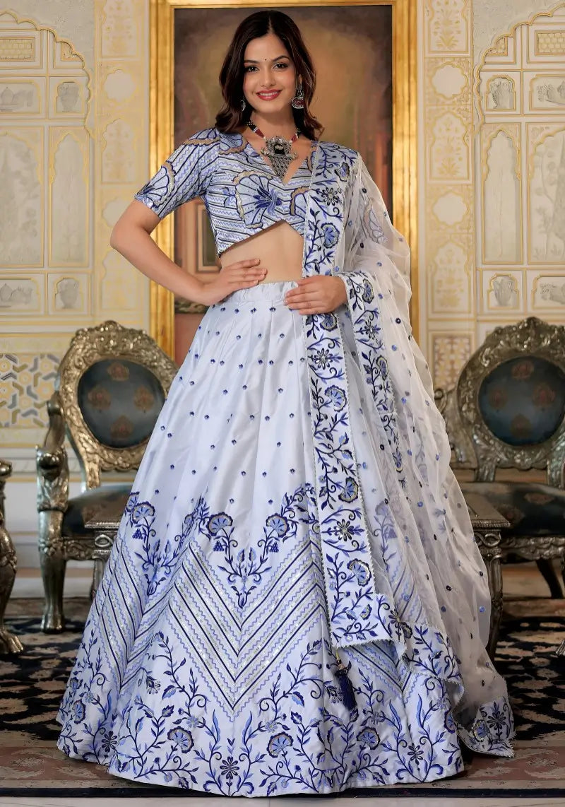 Model wearing White and Blue Heritage Lehenga Choli with dupatta, showcasing front design.