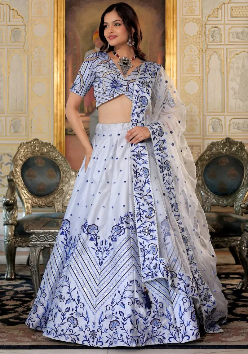 Right side pose of model in White and Blue Heritage Lehenga Choli with dupatta Set with satin embroidery.