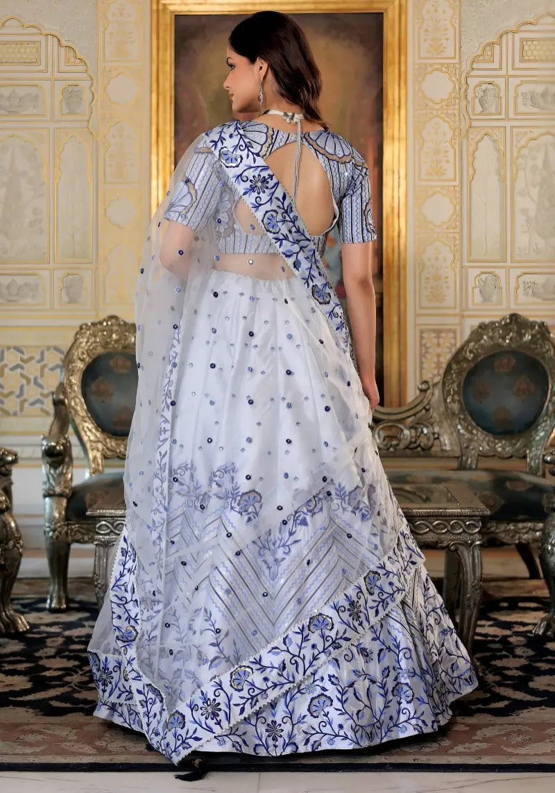 Back view of White and Blue Heritage Lehenga Choli with dupatta Set highlighting satin fabric and detailing.
