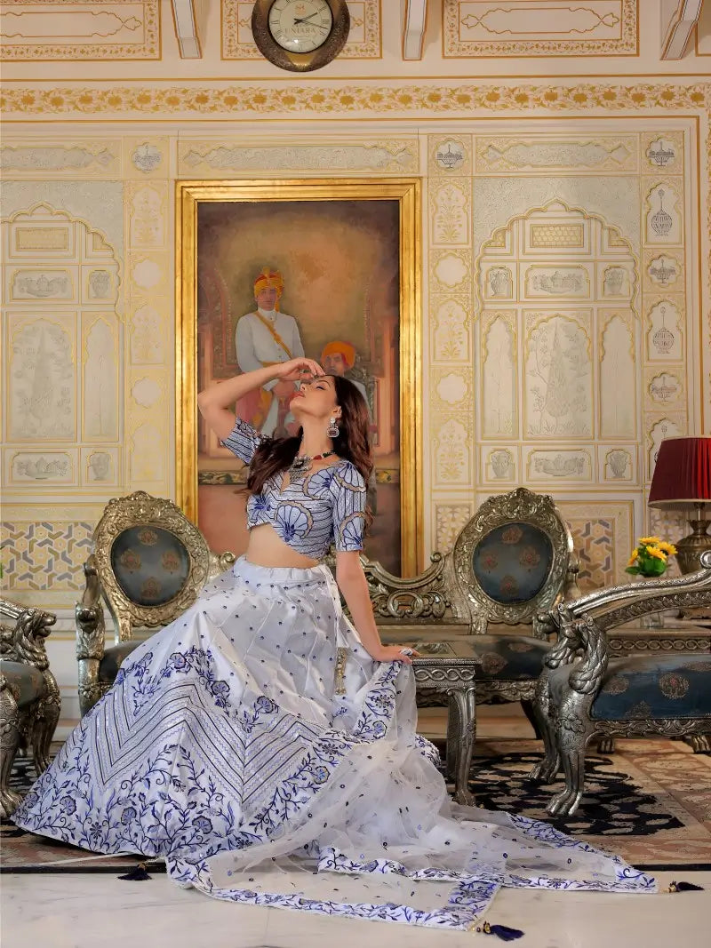 Full expanded view of embroidery on White and Blue Heritage Lehenga Choli with dupatta Set worn by model.