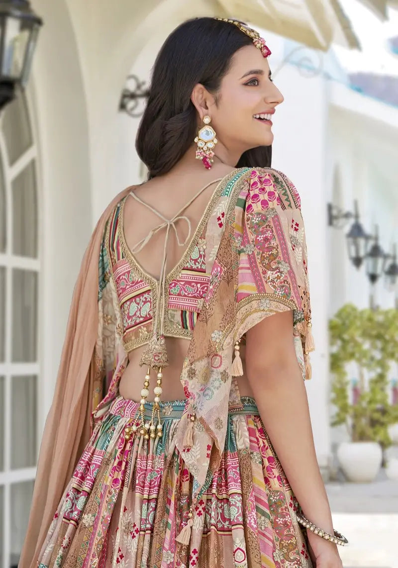 Close-up of back viewโmodel draped in Beige Multicolor Lehenga Set showing embroidery and pearl-dangling blouse details