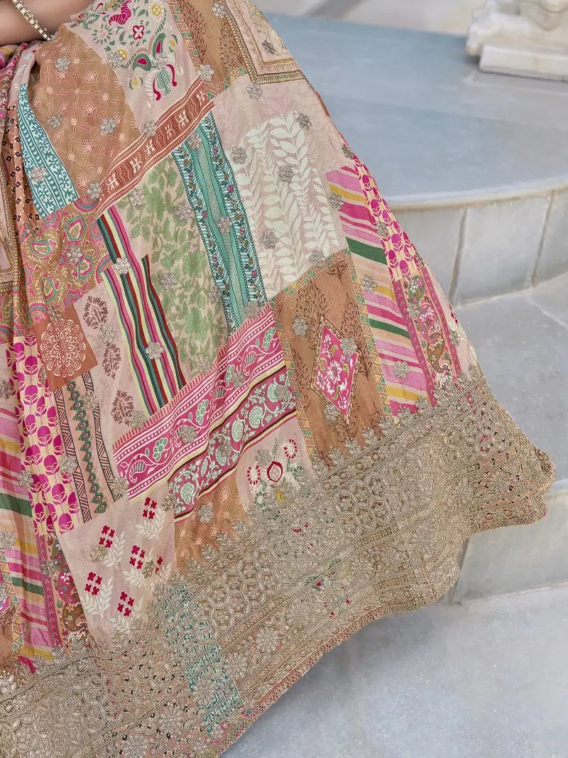 Detailed close-up of zari and dori embroidery on sheer-patterned chinnon silk lehenga.
