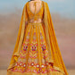 Back view of mustard yellow zari embroidered lehenga choli with resham floral detailing and scalloped neckline