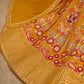 Close-up view of floral zari and resham embroidery with sequins on mustard yellow georgette lehenga 