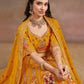 Sitting close-up of model in Mustard Yellow Floral Zari Embroidered Lehenga Choli 