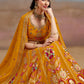 Sitting close-up of model in traditional Mustard Yellow Floral Zari Embroidered Lehenga Choli- A royal ethnic ensemble for a wedding occasion