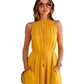 Close view of the model wearing "Yellow Western Halter Neck Pleated Short Dress" featuring sleeveless pleated mock neck dress with pocket s for a stylish look.