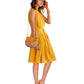 Side view of the model wearing "Yellow Western Halter Neck Pleated Short Dress" featuring sleeveless pleated mock neck dress with pocket s for a stylish look.