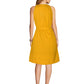 A back view of the model wearing "Yellow Western Halter Neck Pleated Short Dress" featuring sleeveless pleated mock neck dress with pocket s for a stylish look.