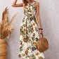 Model wearing Tropical Bloom White Floral Sleeveless Midi Dress front view