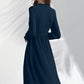 Back view of Morpich midi dress featuring soft pleated hem and elegant flowy silhouette.