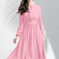 Peach midi dress with keyhole neckline, ruffle detailing, and sheer bishop sleeves on model.                                