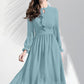 Pista ruffle midi dress worn by model featuring sheer bishop sleeves and keyhole neckline.