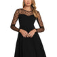 Front view of black A-line dress with sheer polka dot mesh sleeves and illusion sweetheart neckline – chic party wear.