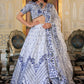 Model wearing White and Blue Heritage Lehenga Choli with dupatta, showcasing front design.