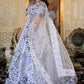 Left side pose of model in White and Blue Heritage Lehenga Choli with dupatta Set with satin embroidery.