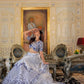 Full expanded view of embroidery on White and Blue Heritage Lehenga Choli with dupatta Set worn by model.