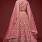 Back view of the model wearing Fantasy Rose soft net lehenga choli set with detailed embroidery and matching dupatta.