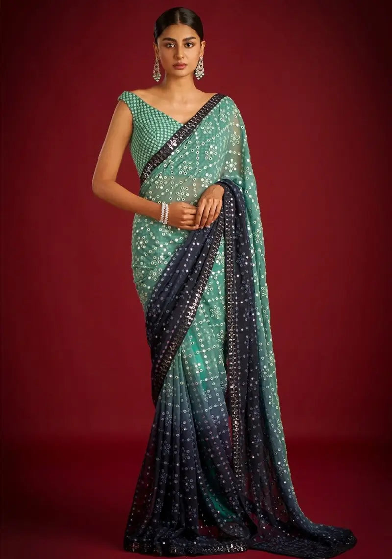 Magnificent Blue-Green Georgette Saree with Heavy Sequins