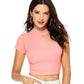 Model wearing a trendy peach one shoulder crop top with cut-out detail, front view.