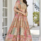 Right side pose of model showcasing flowy silhouette of multicolor printed chinnon silk lehenga with embroidered blouse