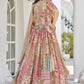 Back view of model in Beige Embroidered Lehenga Set highlighting scalloped hem blouse and chiffon dupatta