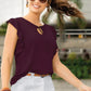 Front view of the model wearing wine solid cap sleeves top with designer cap sleeves and keyhole tie neckline.