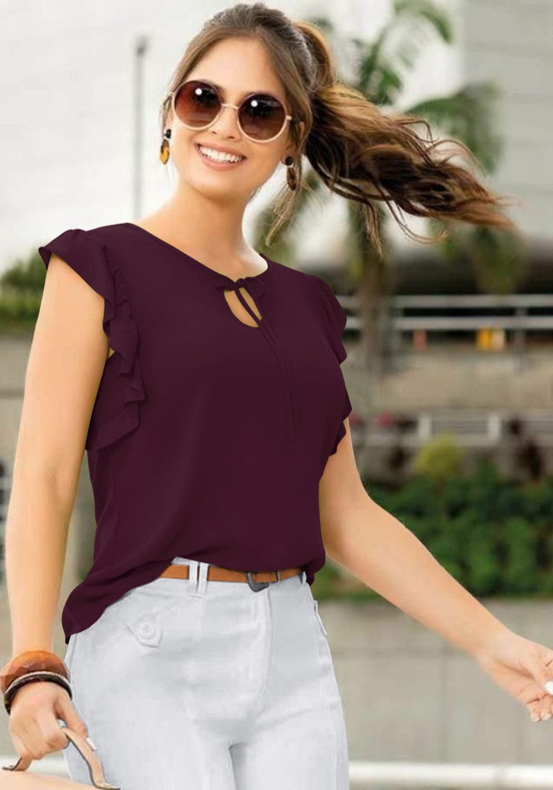 Front view of the model wearing wine solid cap sleeves top with designer cap sleeves and keyhole tie neckline.