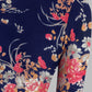Close up of the model wearing Snazzyhunt Trendy Floral Crop Top in navy blue
