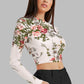 Right side view of the model wearing Snazzyhunt Trendy Floral Crop Top in Pearl White