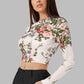Left side view of the model wearing Snazzyhunt Trendy Floral Crop Top in Pearl White