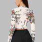 Back view of the model wearing Snazzyhunt Trendy Floral Crop Top in white color
