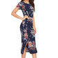 Rt. Side view of the model wearing Enticing Blue Floral Printed Side-Slit Bodycon Dress with short sleeves and a round neckline.