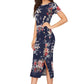 Lt. side view of the model wearing Enticing Blue Floral Printed Side-Slit Bodycon Dress with short sleeves and a round neckline.
