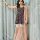 Front view of the model in a navy blue embroidered sharara suit with a net dupatta, featuring heavy floral embroidery work.